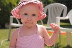Baby in a pink bonnet
